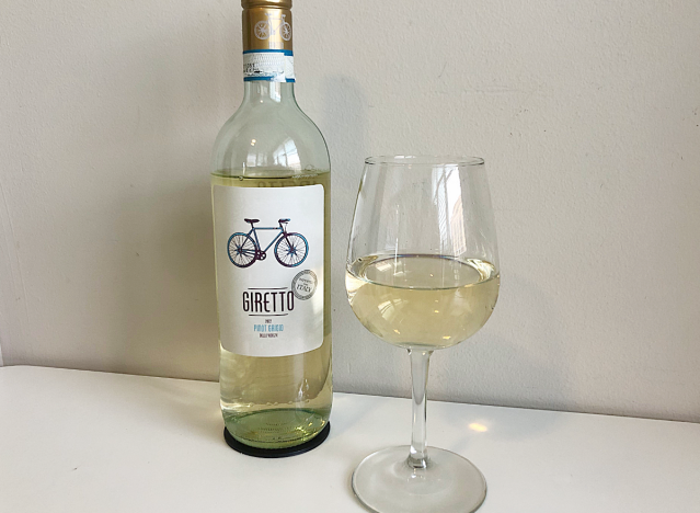 a bottle of pinot grigio with a glass of wine