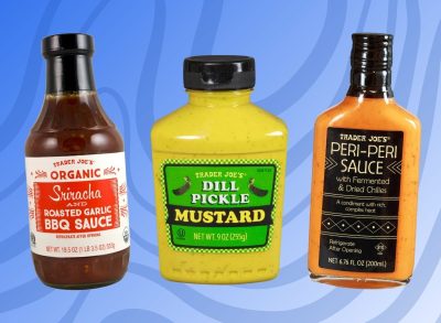 trader joe's organic sriracha and roasted bbq sauce, dill pickle mustard, and peri-peri sauce on designed blue background