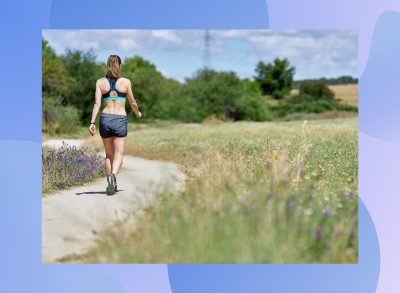 brunette woman walking outdoors on trail