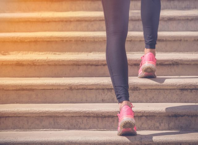 close-up woman doing walking stairs workout
