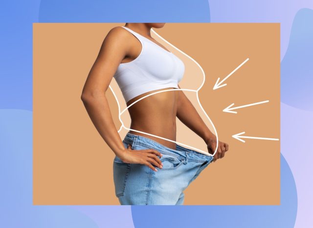 woman holding big pair of jeans out from waist, concept of fat loss and weight loss