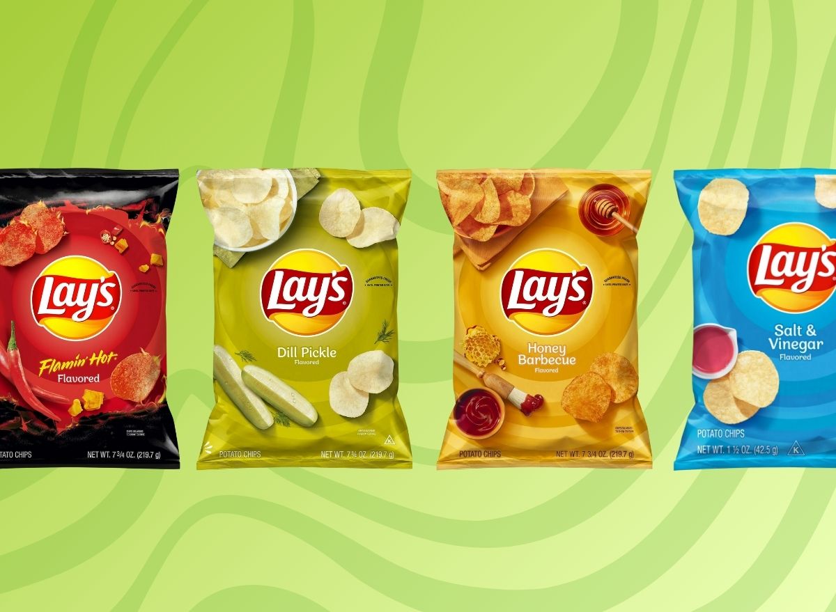 assorted bags of lays chips on green background