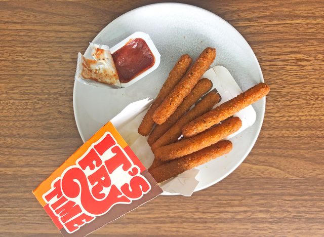 Mozzarella fries from Burger King on a white plate with a side of marinara for dipping