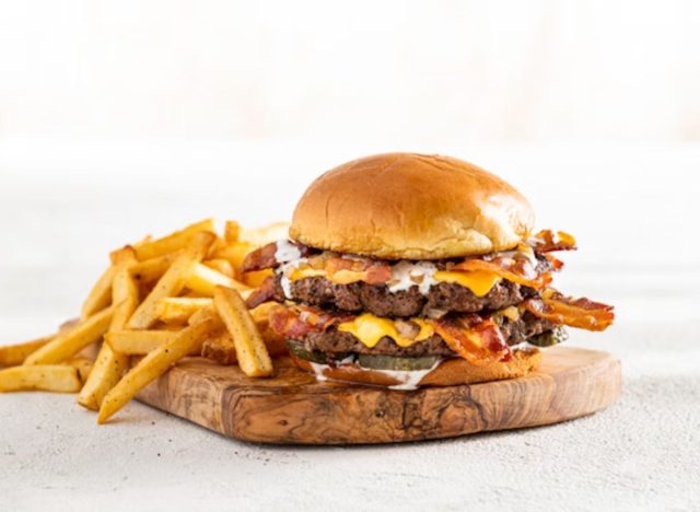 Chili's burger and fries on wooden slab