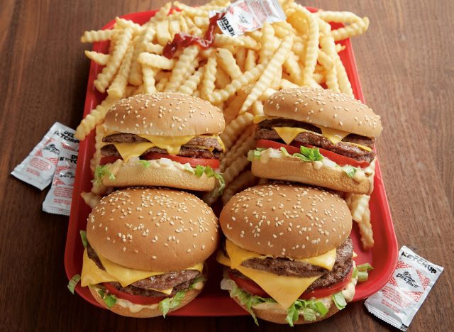 A tray of del taco double del cheeseburgers and fries 