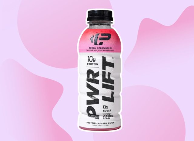 bottle of PWR LFT protein water on a pink background