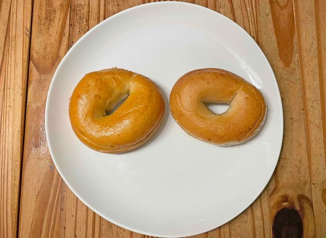 A pair of plain bagels from Panera Bread (left) and Einstein Bros. (left)