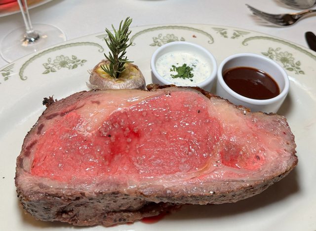 A cut of juicy prime rib on an ornate plate at The Palm restaurant