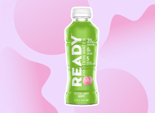 bottle of Ready Protein Water on a pink background