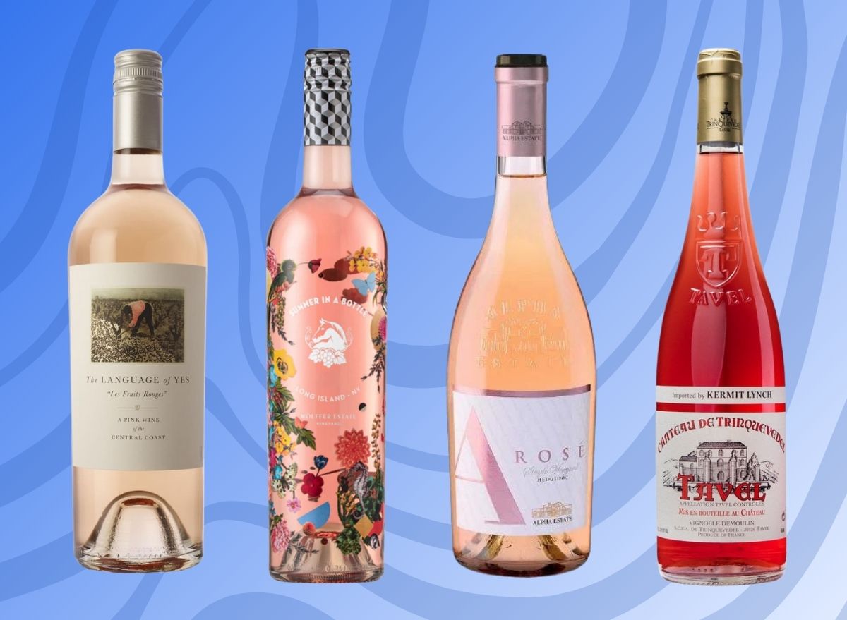 A group of four rose wines set against a vibrant blue background