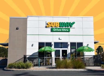 Subway exterior on striped orange background