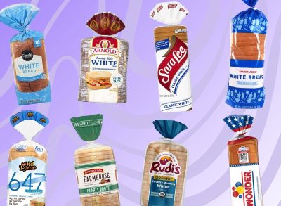 An array of store-bought white bread brands set against a vibrant purplish background