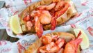 cousin's maine lobster rolls with lemon wedges
