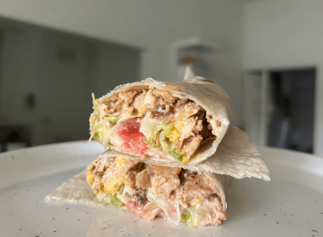 a del taco burrito cut open on a countertop 