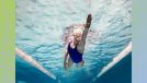 female swimmer swimming laps in pool