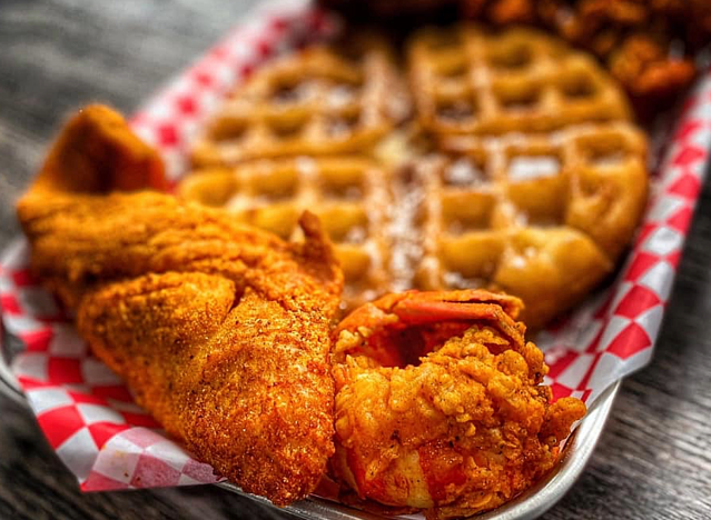 a basket of chicken and waffles from helen's