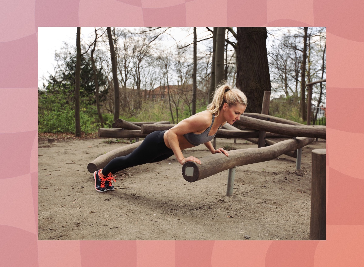 woman doing incline pushups outdoors in the woods