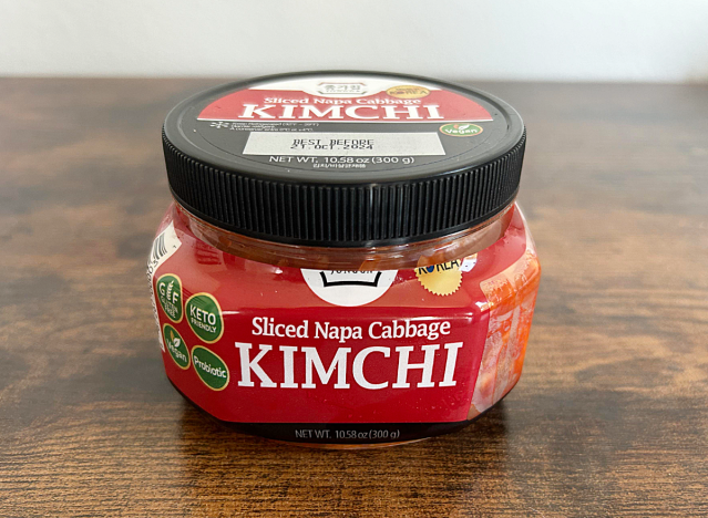 a jar of jongga kimchi on a table 