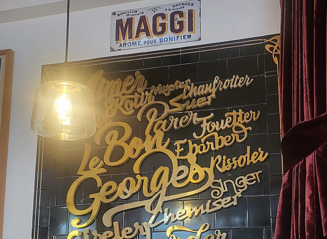 a sign advertising maggi at a french restaurant 