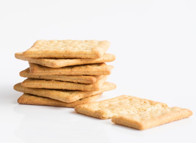 whole wheat flour crackers isolate on white background selective focus