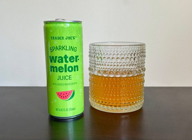 can of trader joe's sparkling watermelon juice next to a glass of the beverage