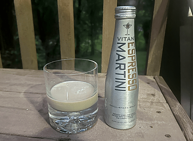 a bottle of vitani espresso martini next to a glass 