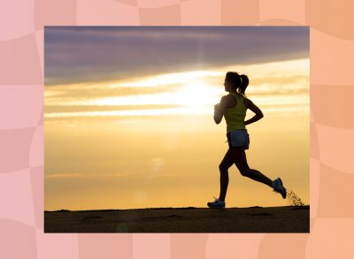 woman jogging at the beach at sunset