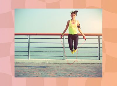 woman jumping rope outdoors in the sun