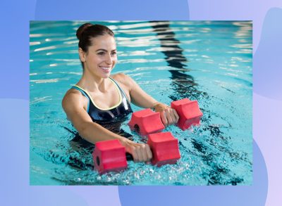 fit brunette woman doing pool workout