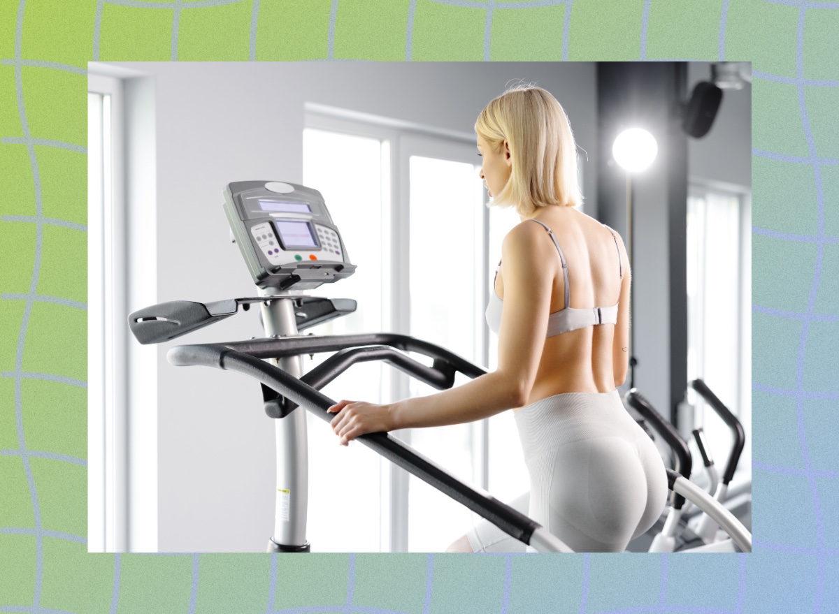 fit blonde woman using stair climber machine at the gym