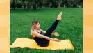 focused woman doing V-up exercise on yellow yoga mat on yawn