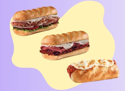 Three Firehouse Subs sandwiches on a graphic background.