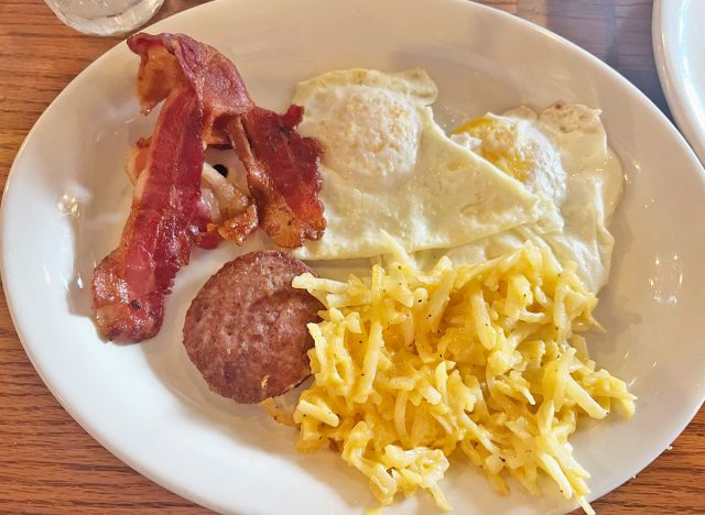 two Buttermilk Pancakes, two eggs & a sampling of Thick-Sliced Bacon, Smoked Sausage & Ham at Cracker Barrel
