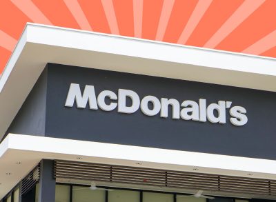 McDonald's restaurant sign on striped red background