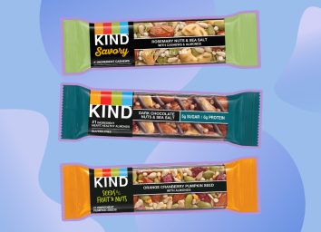 collage of three KIND bars on a designed blue background