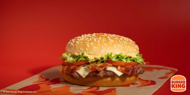 burger king fiery bacon whopper on a red background