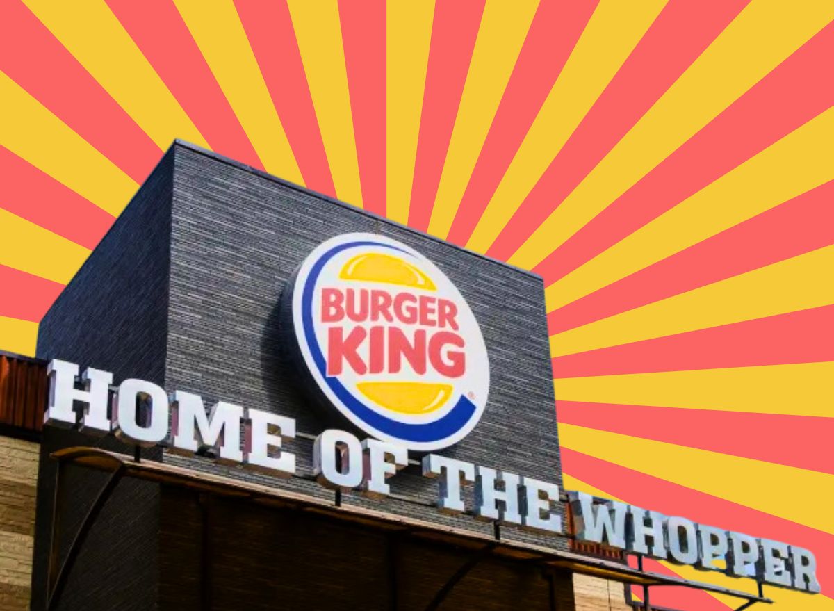 burger king exterior with a red and yellow striped background