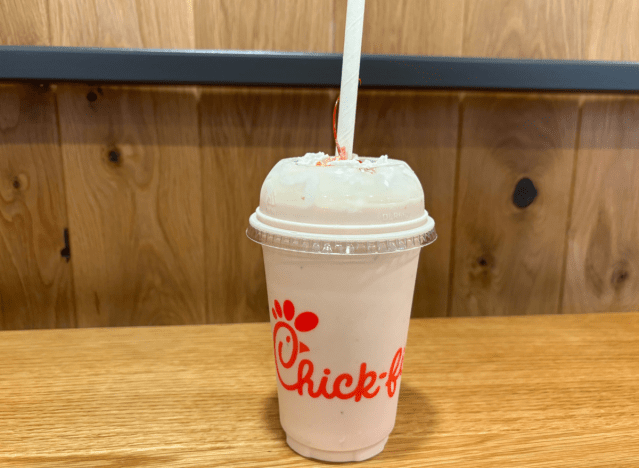 chick fil-a strawberry shake on a table