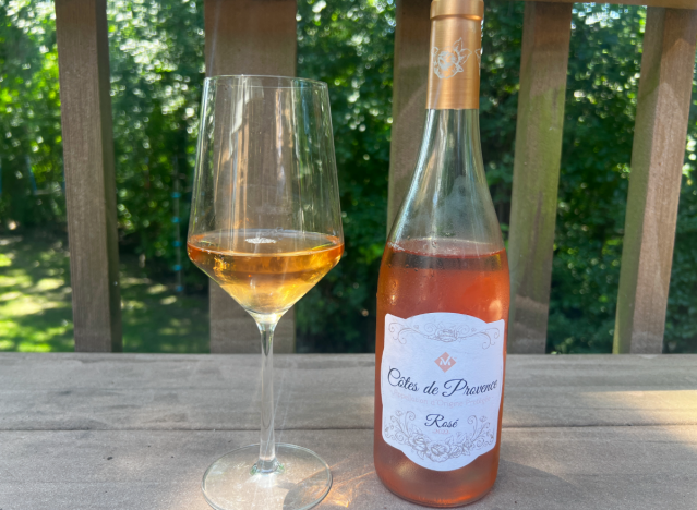 cotes de provence rose bottle next to a glass 