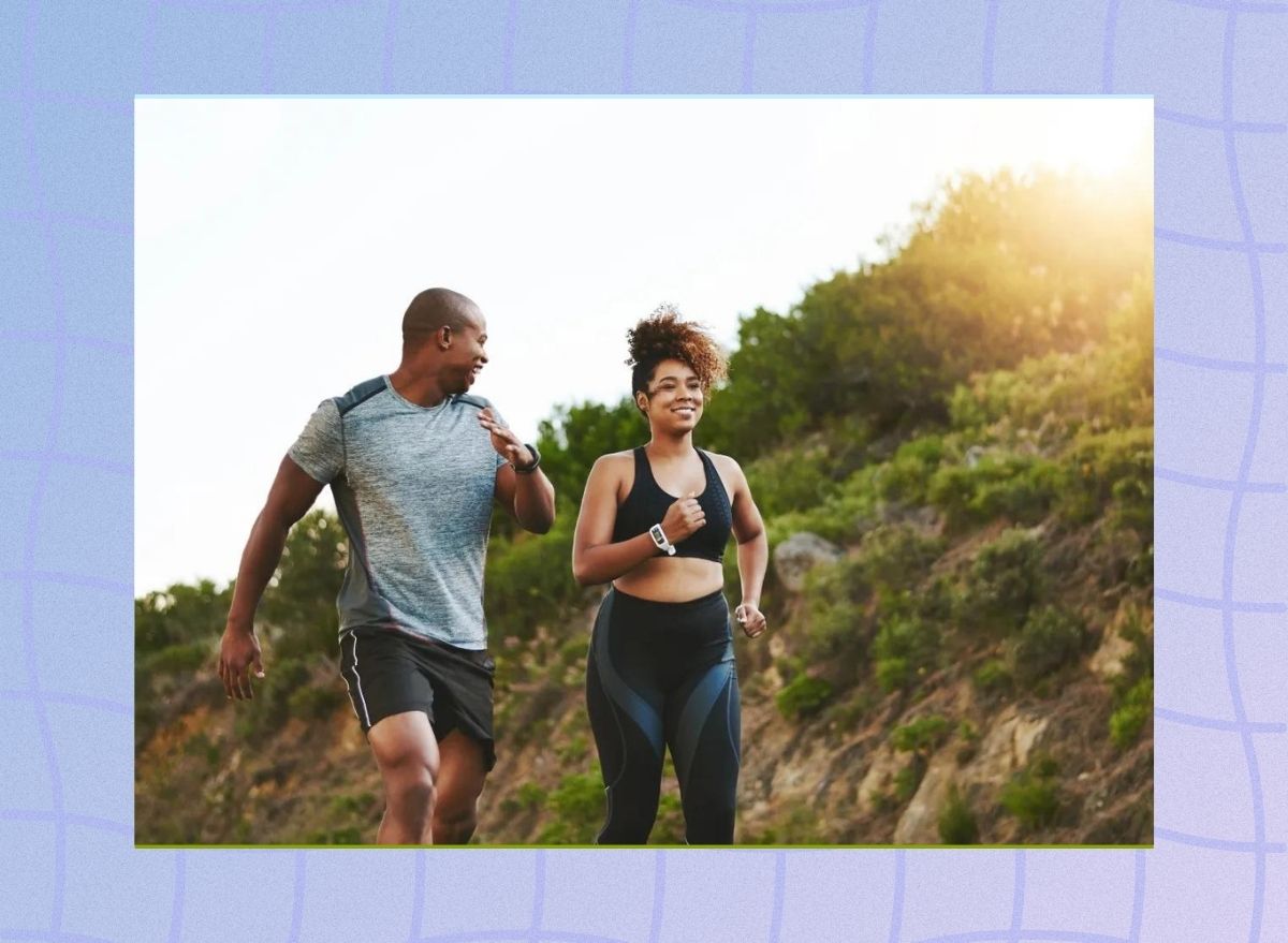 a photo of two people walking in an idyllic mountain setting on a designed blue background