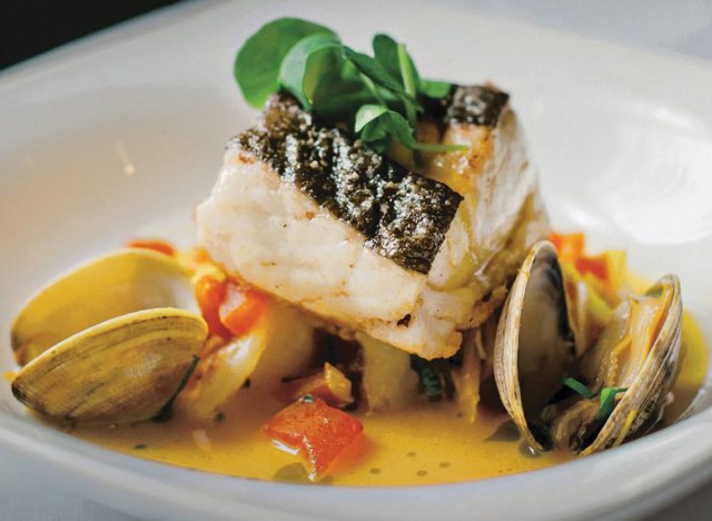 Atlantic halibut with Wellfleet clam and tomatoes in citrus butter at Davio's Northern Italian Steakhouse.