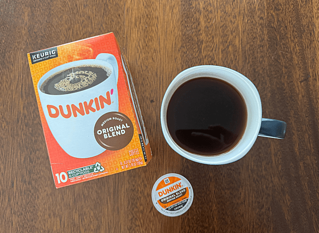 dunkin k cup box next to mug of coffee 