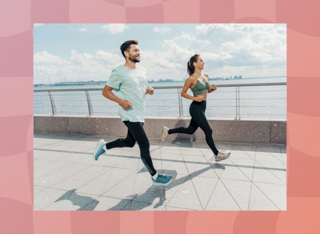 fit couple running outdoors along the water for exercise