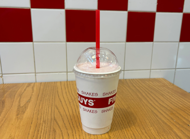 five guys strawberry shake on a table 