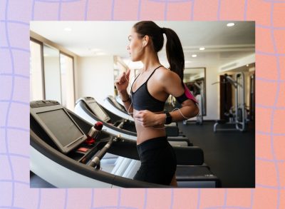 fit, focused woman running on the treadmill at the gym