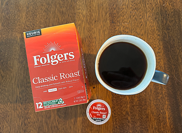 folgers k cup box next to a mug of coffee