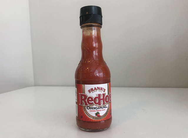 a bottle of frank's red hot sauce 