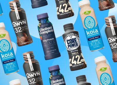 various brands of protein drinks on a blue background