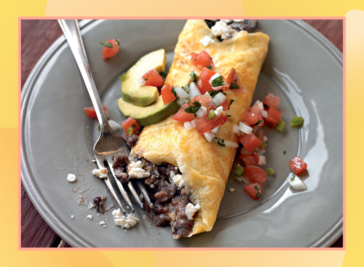 high protein omelet with black beans topped with pico de gallo and avocado slices