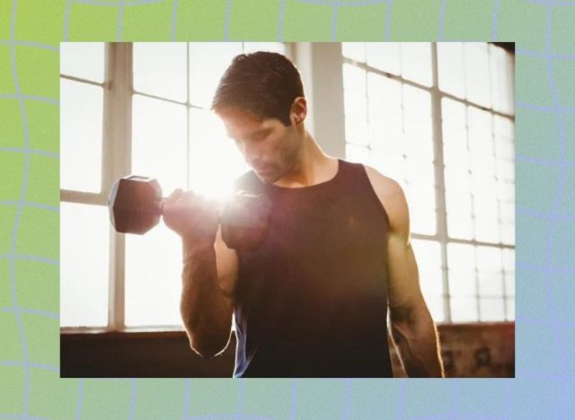 a photo of man lifting weights on a designed bluish green background